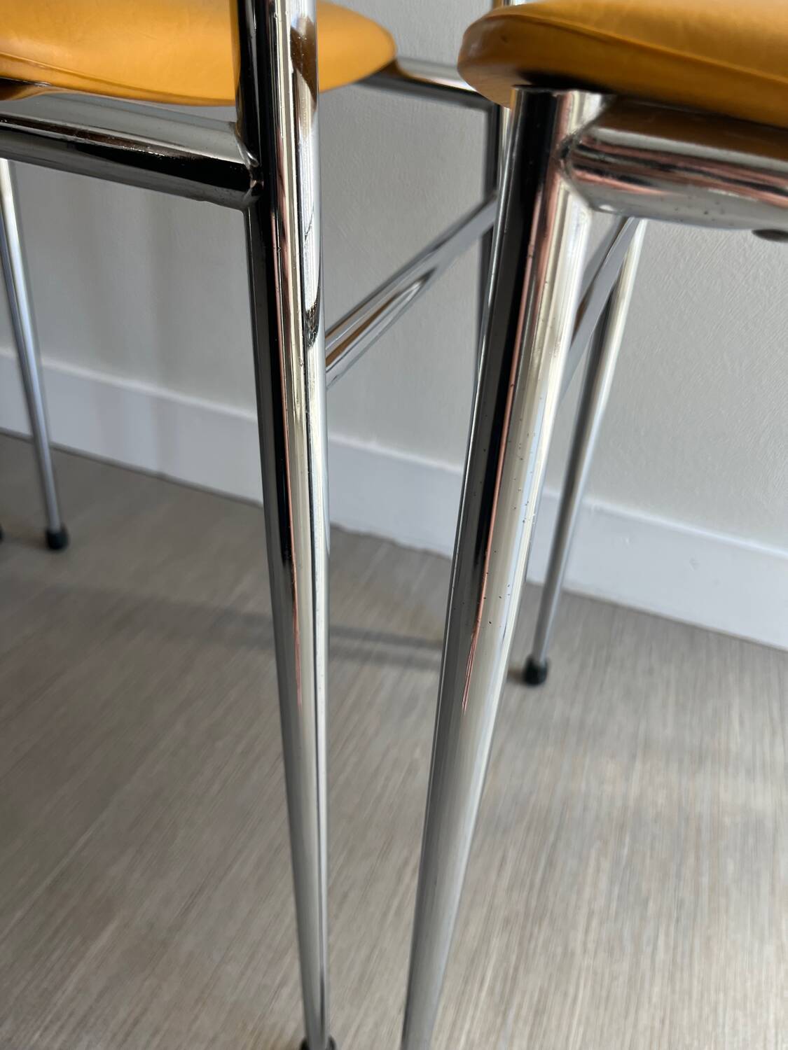 LM vintage chrome and orange/mustard yellow faux leather chairs