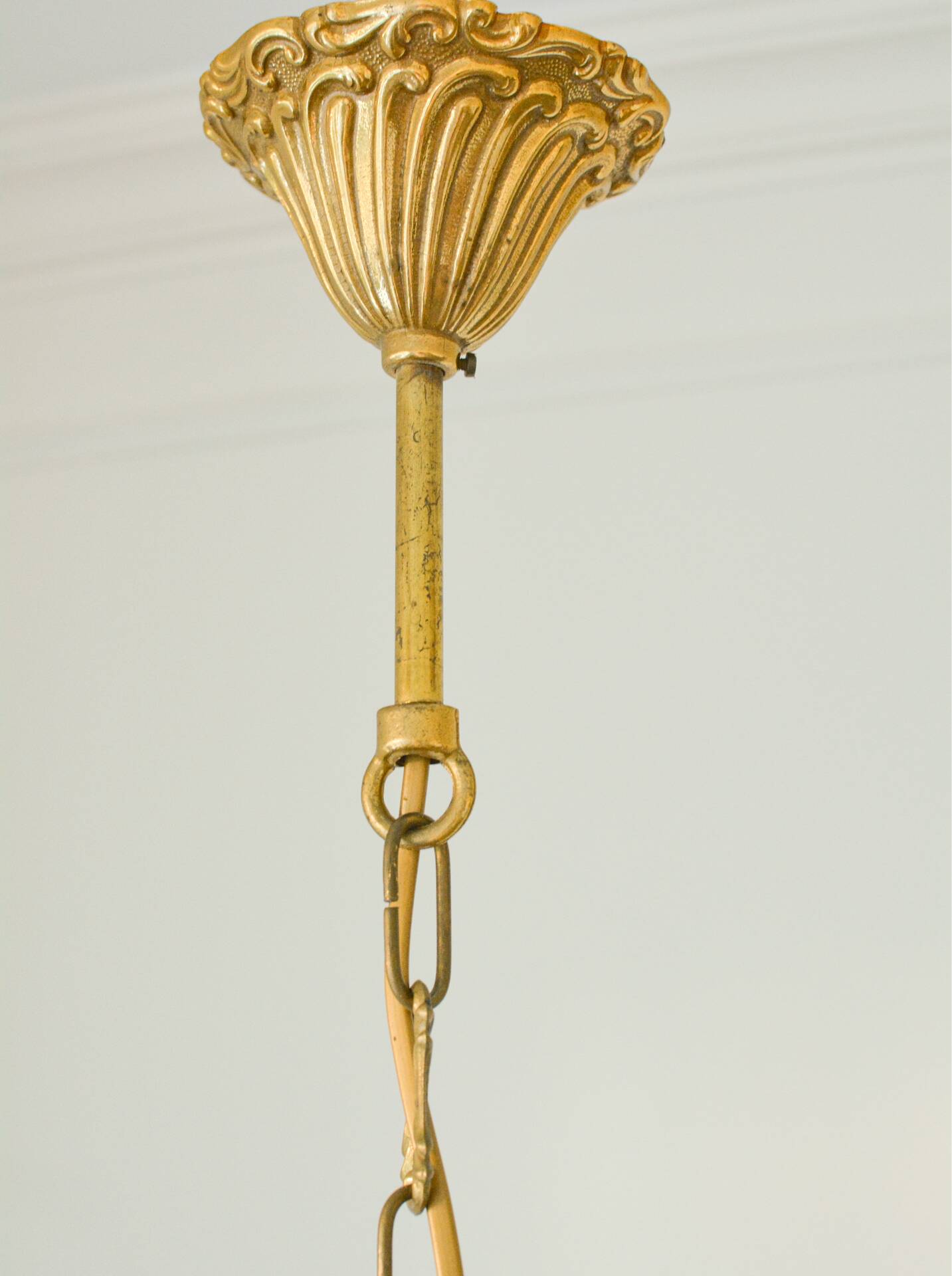 Small vintage brass chandelier with amber crystal pendants.