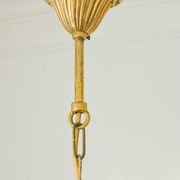 Small vintage brass chandelier with amber crystal pendants.