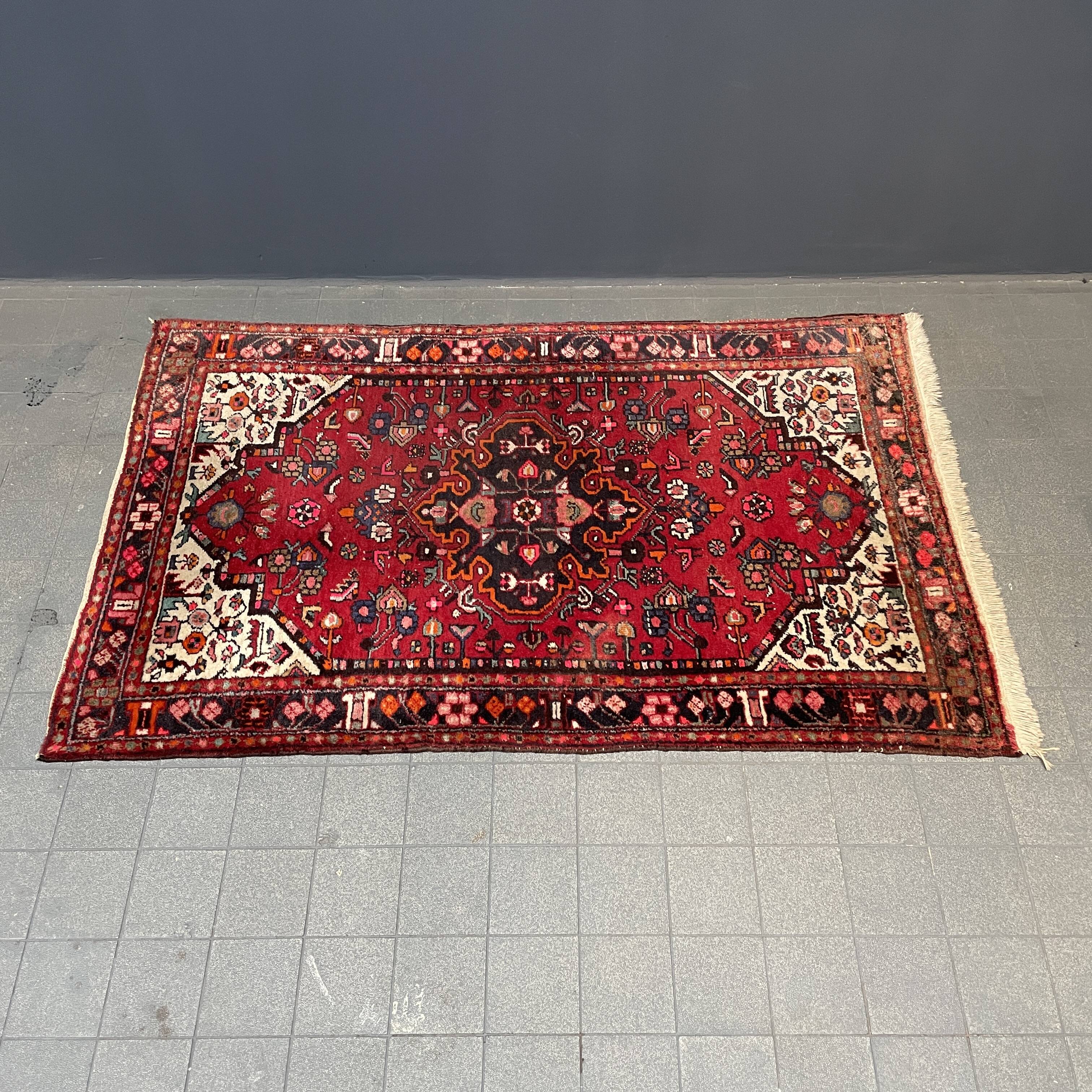 Worn vintage oriental rug or carpet