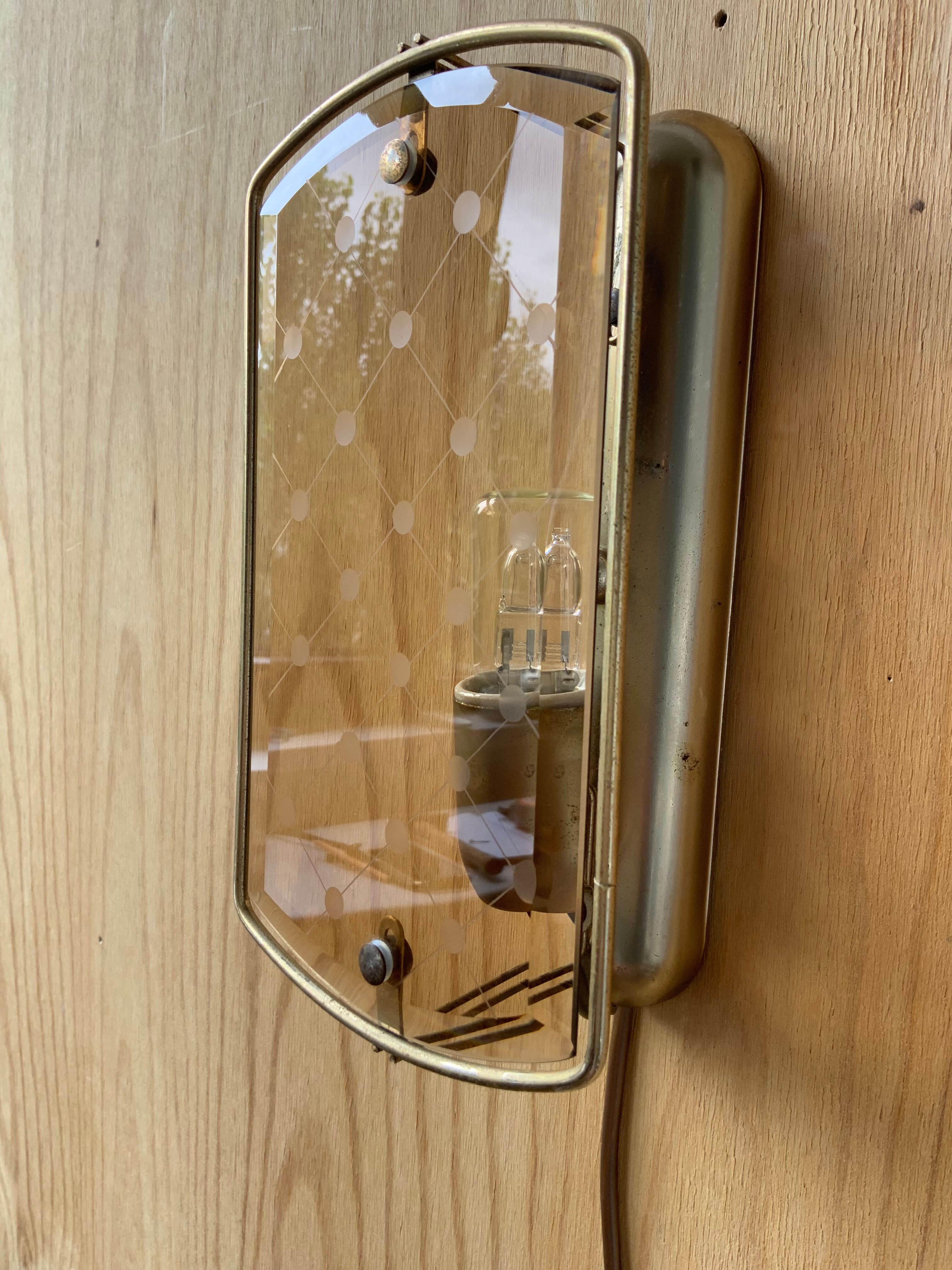 Brass wall lamp and smoked glass