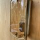 Brass wall lamp and smoked glass