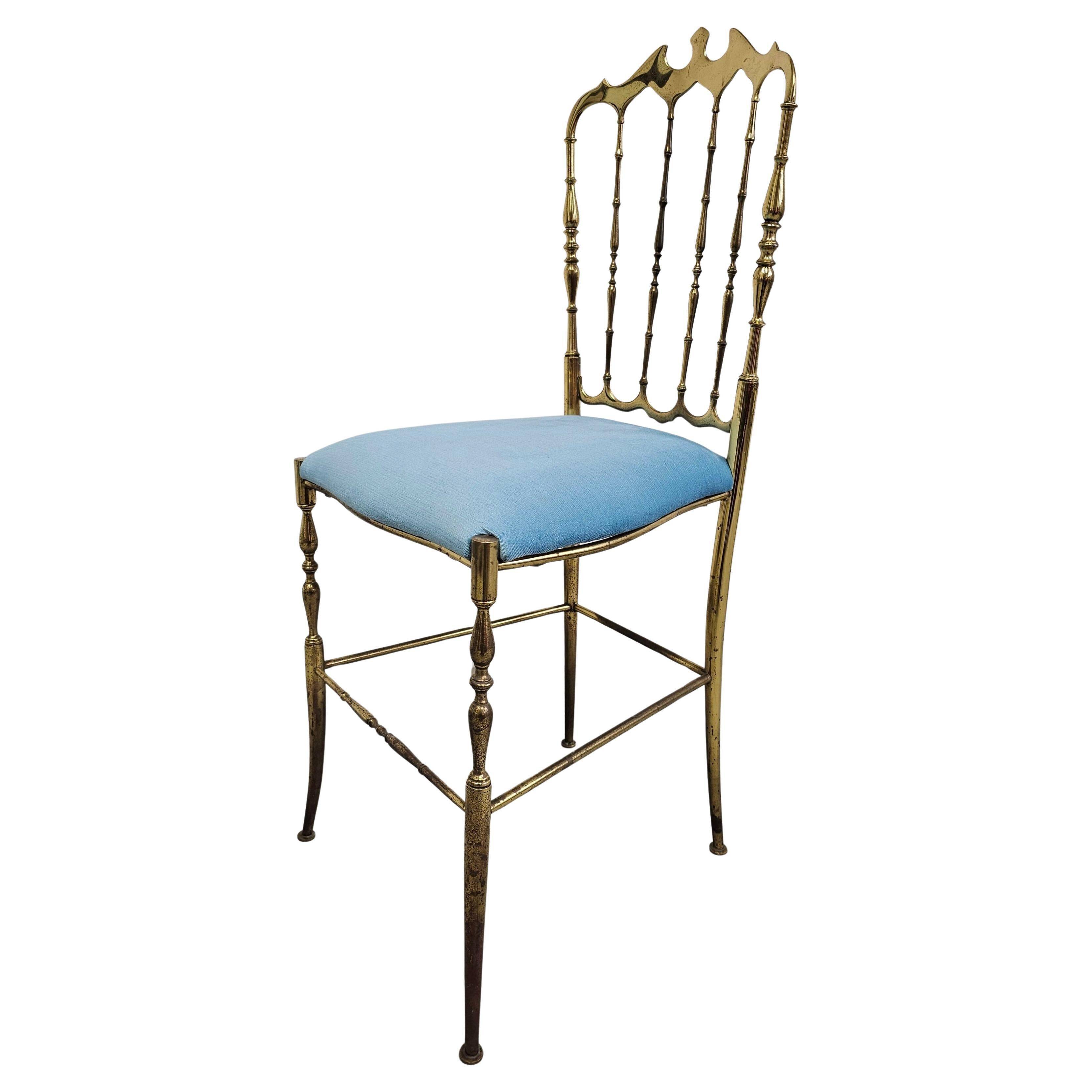 Mid-century Chiavari accent chair in solid brass with a plush seat.