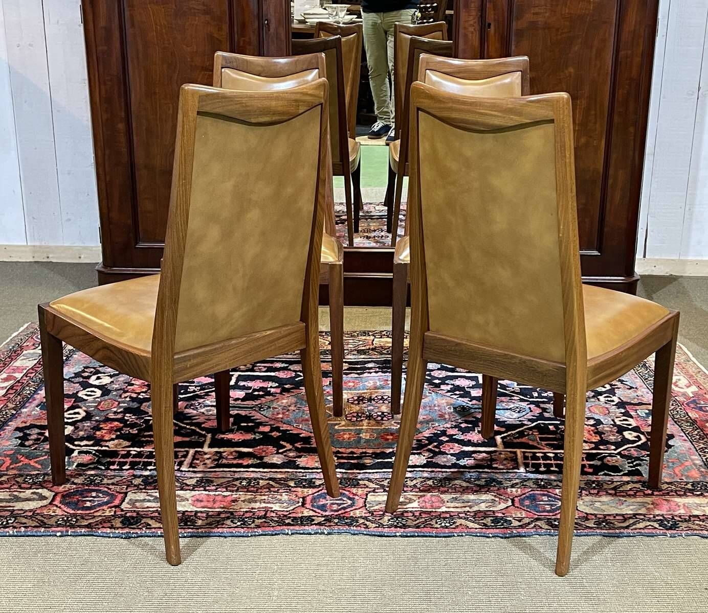Set of 4 G-Plan chairs in teak and faux leather from the 1970s.