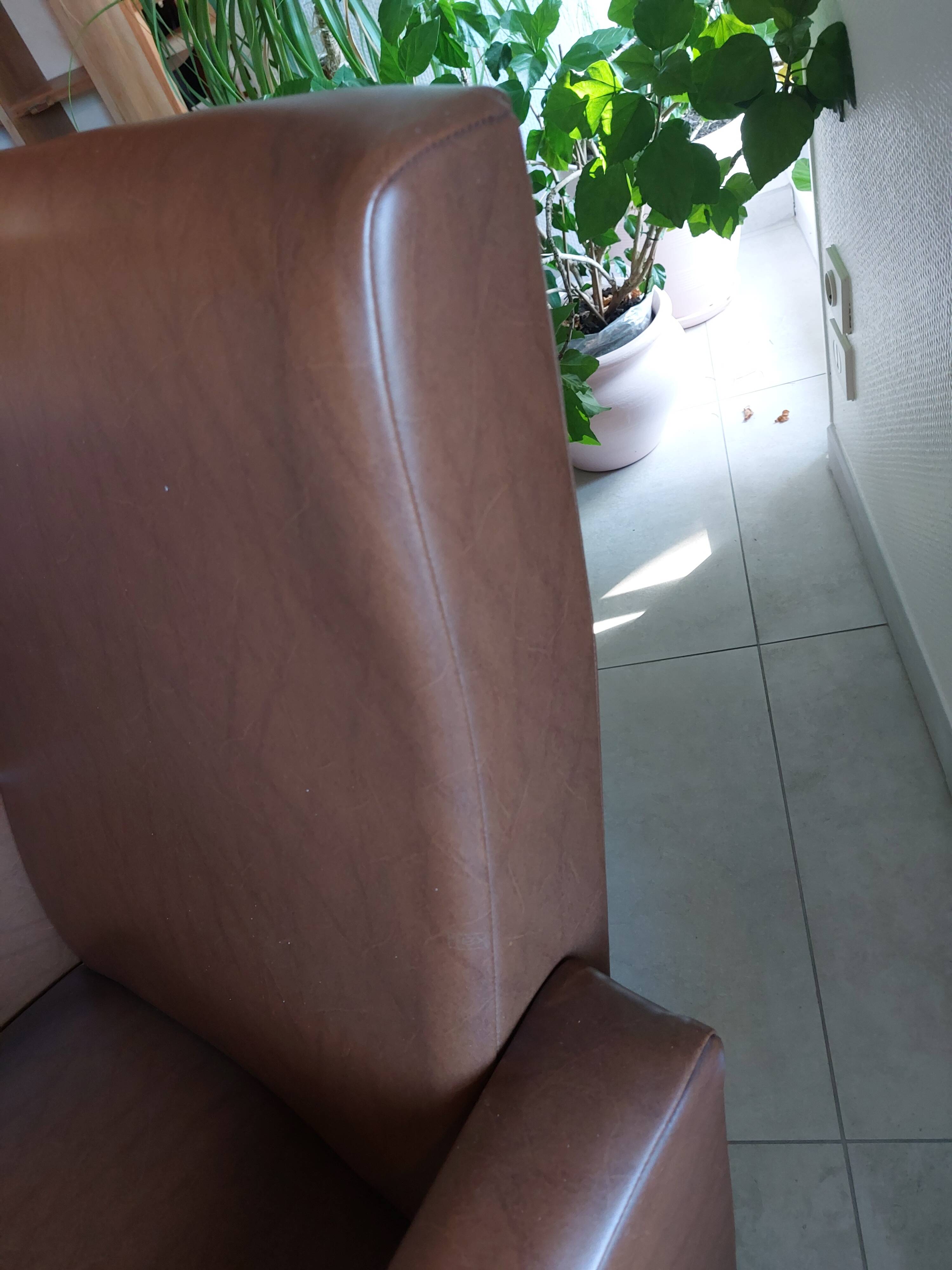 a pair of comfortable vintage armchairs with splayed legs