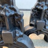 Pair of cast iron chenets with stylized faces High Epoch SEVENTEENTH century