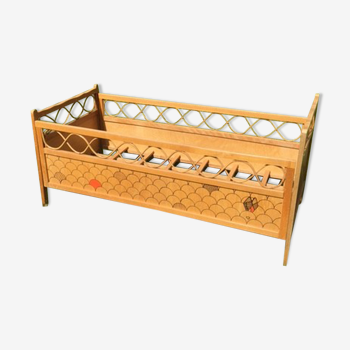 Wood and rattan baby bed