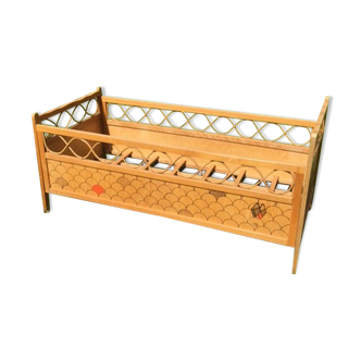 Wood and rattan baby bed