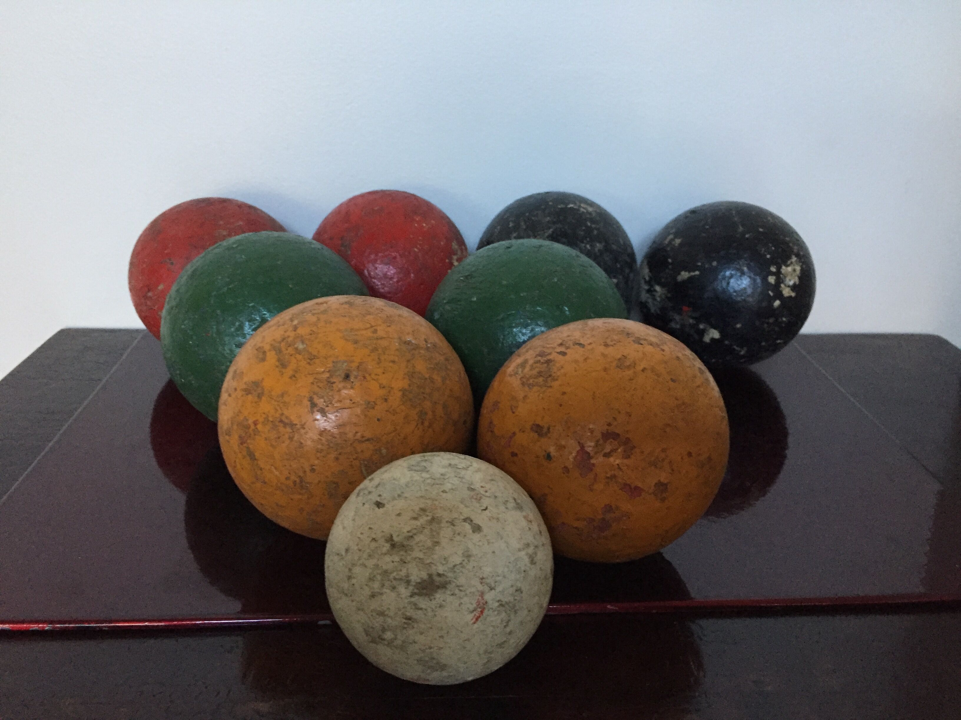 Very old game of wooden petanque balls with piglet