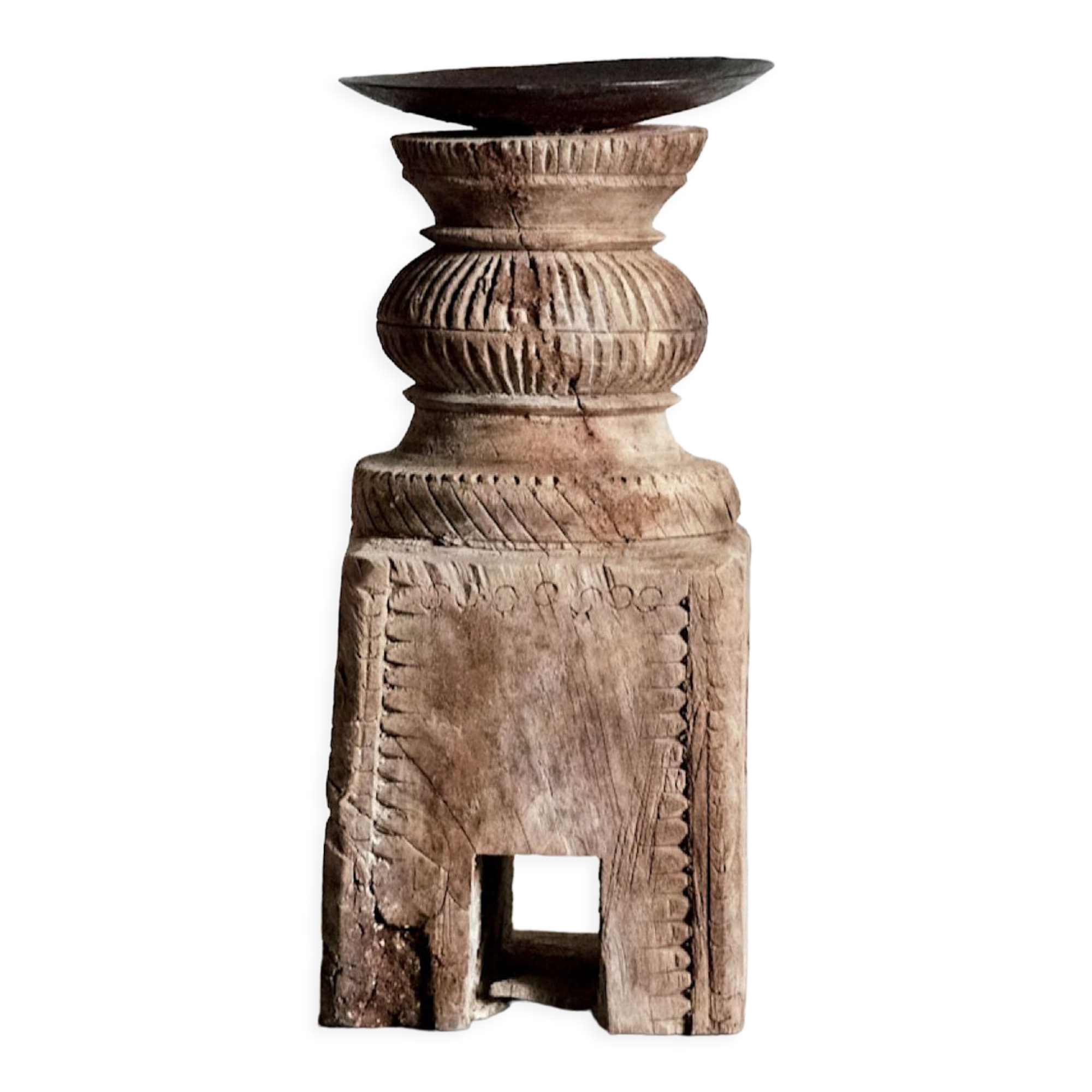 Candle holder in light carved wood