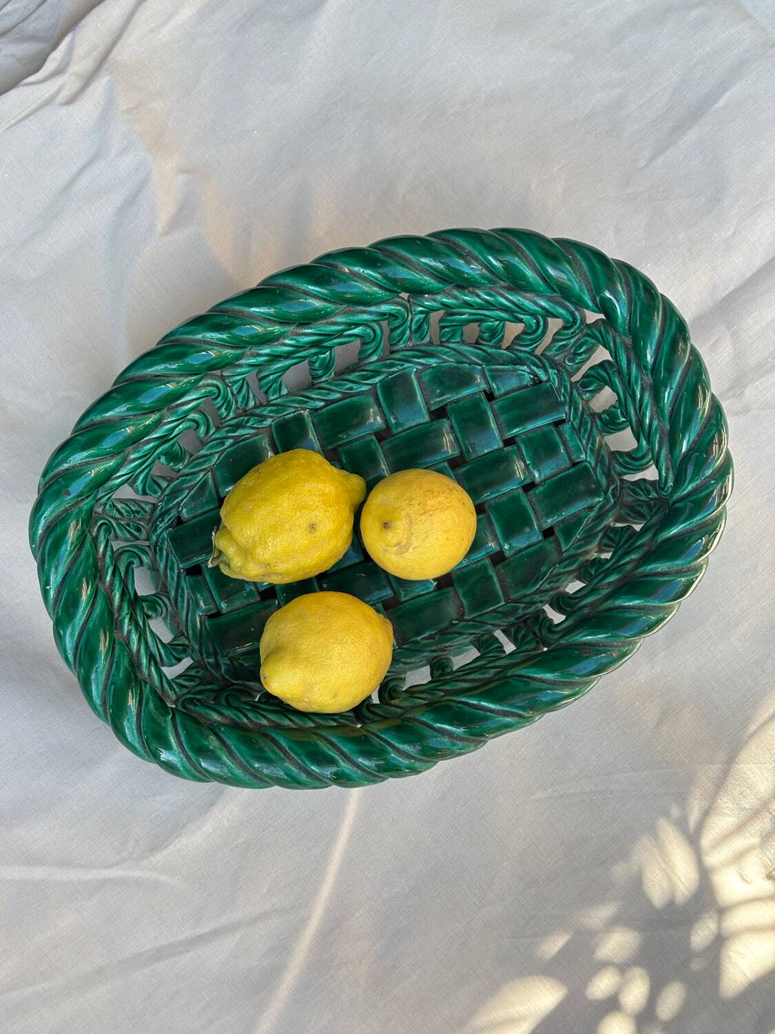 Green woven ceramic basket