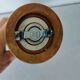 Turned wooden pepper mill