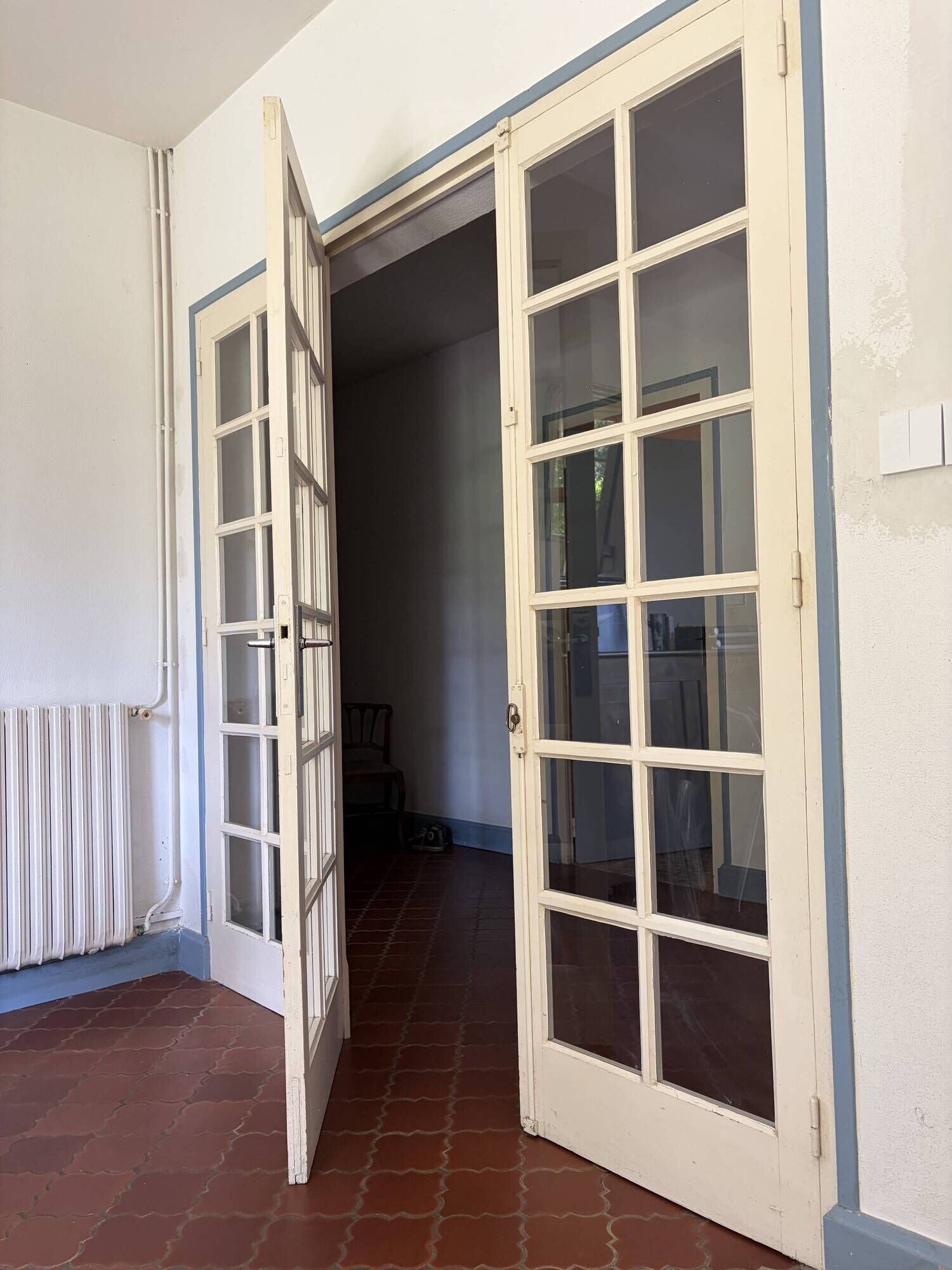 Triptych glass door with three panels featuring small panes. Vintage.