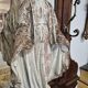 Garden statue of the Virgin Mary in old reconstituted stone