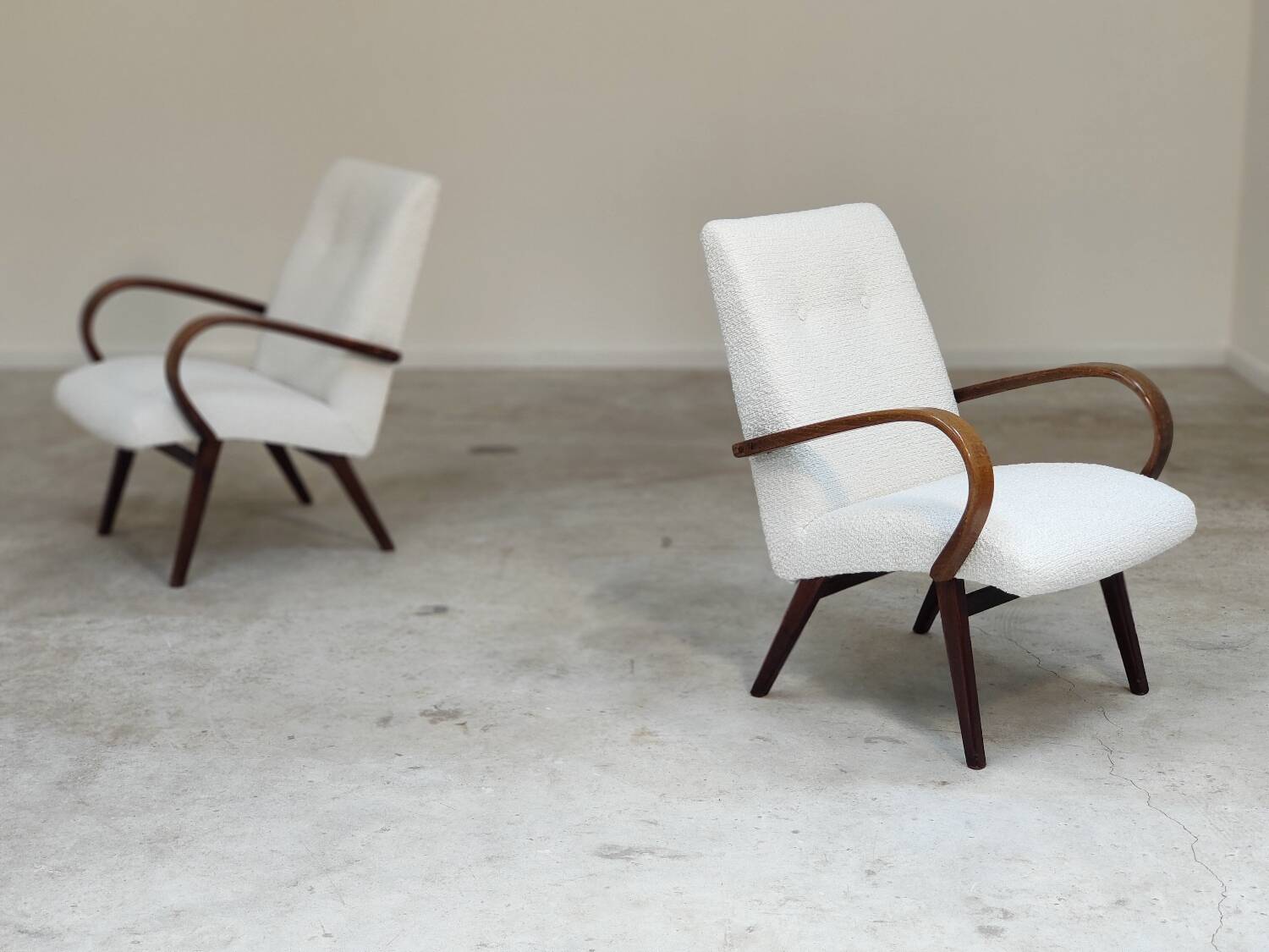 Pair of Jaroslav Smidek armchairs for Ton Bystrice, restored with white boucle, 1960.