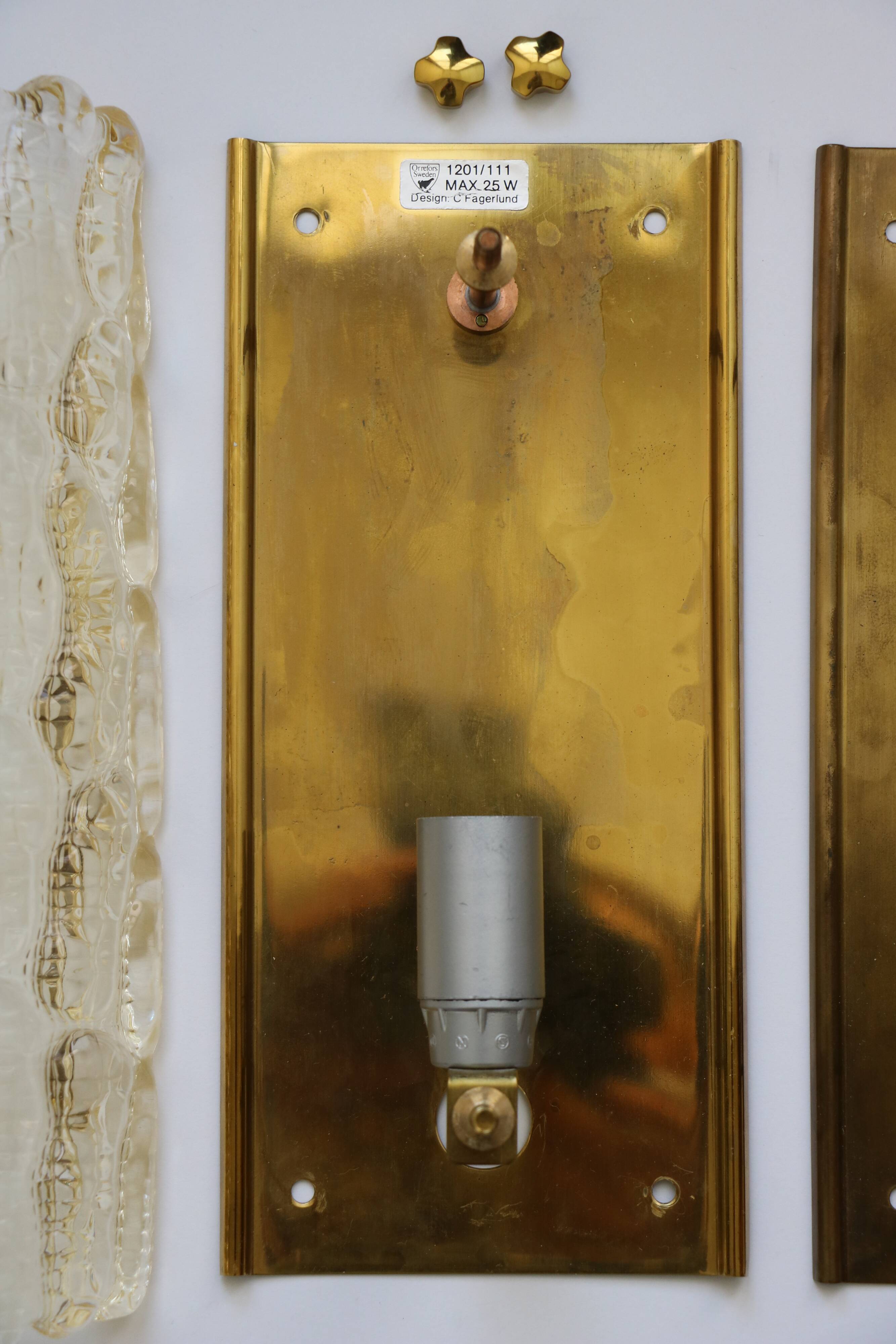 Pair of glass and brass wall lights by Carl Fagerlund for Orrefors, 1960.