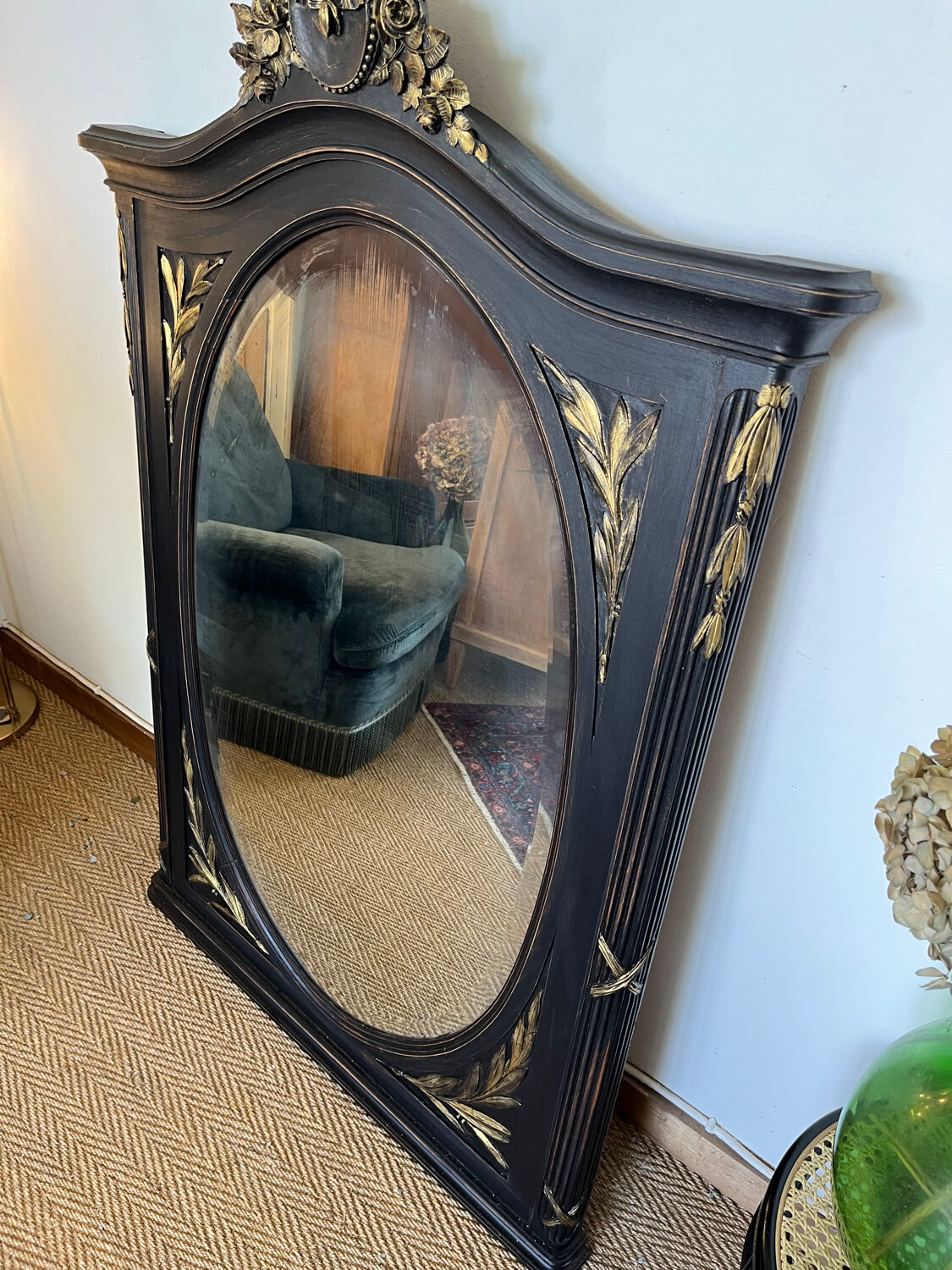 Large old trumeau mirror in black and gilded wood Napoleon style