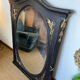 Large old trumeau mirror in black and gilded wood Napoleon style