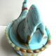 Sweet sugar candy Vallérysthal, blue opaline marbled with brown: Hen on nest