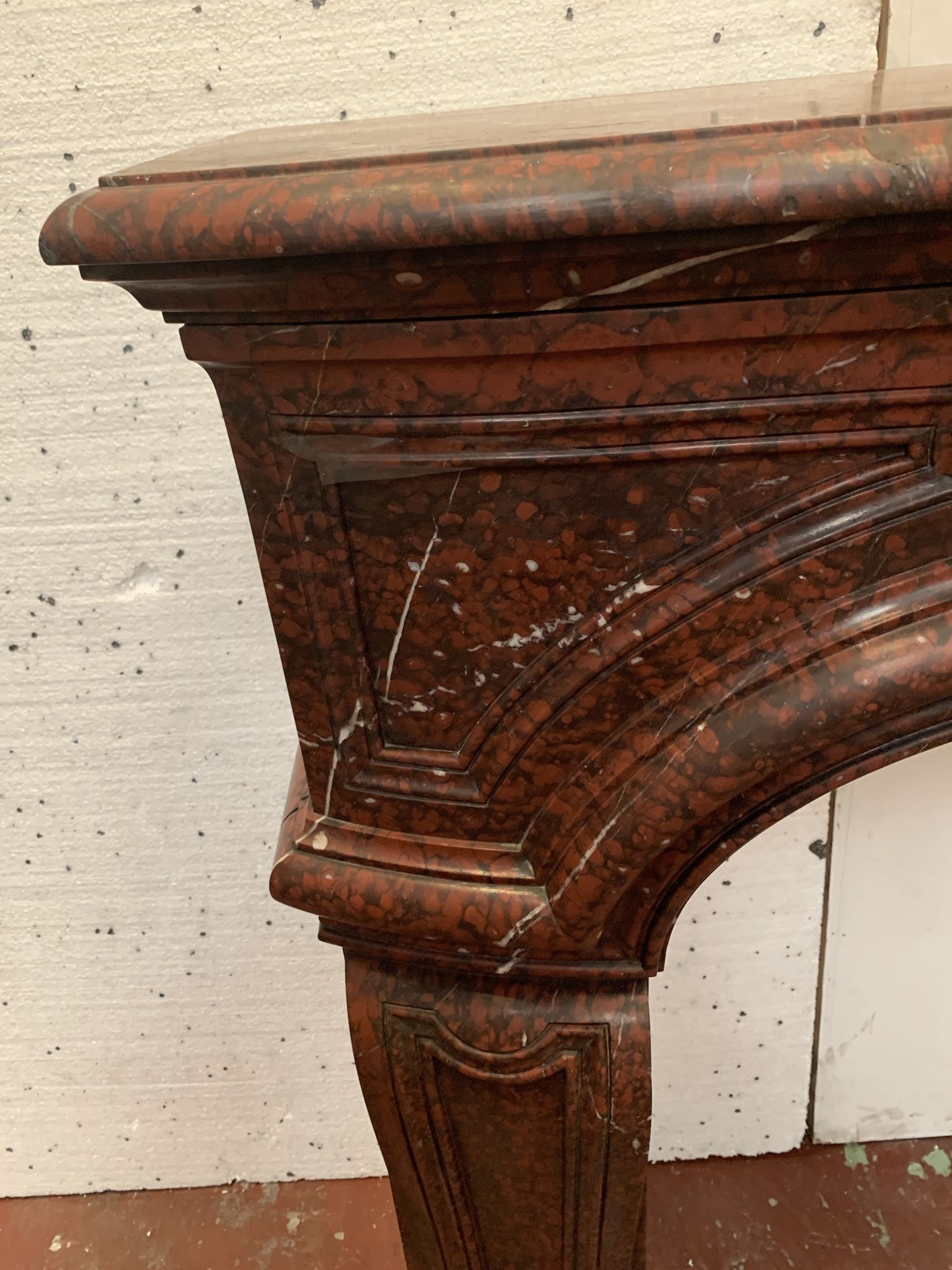 Pair of Louis XIV style fireplaces in red cherry marble. XIX century.