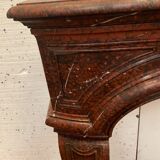 Pair of Louis XIV style fireplaces in red cherry marble. XIX century.