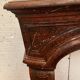 Pair of Louis XIV style fireplaces in red cherry marble. XIX century.