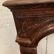 Pair of Louis XIV style fireplaces in red cherry marble. XIX century.