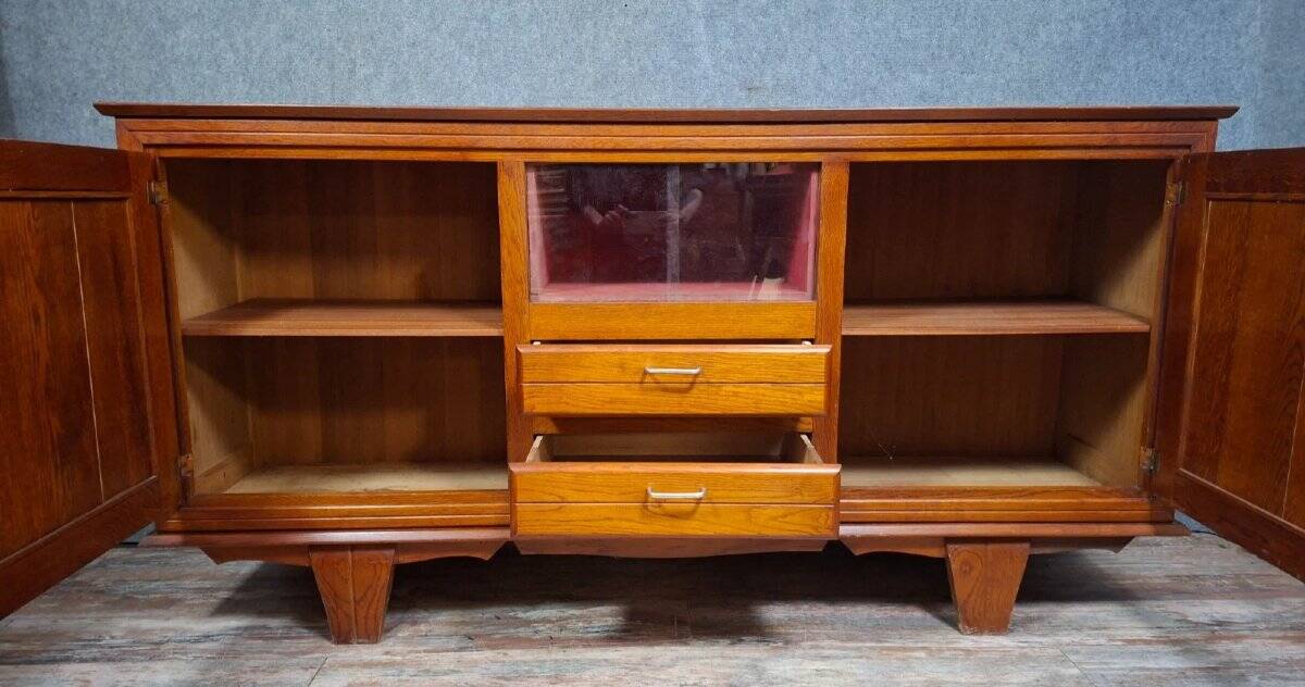 Low buffet in carved oak, Art Deco style, circa 1930.