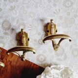 Trio of brass coat hooks or coat racks