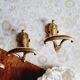 Trio of brass coat hooks or coat racks