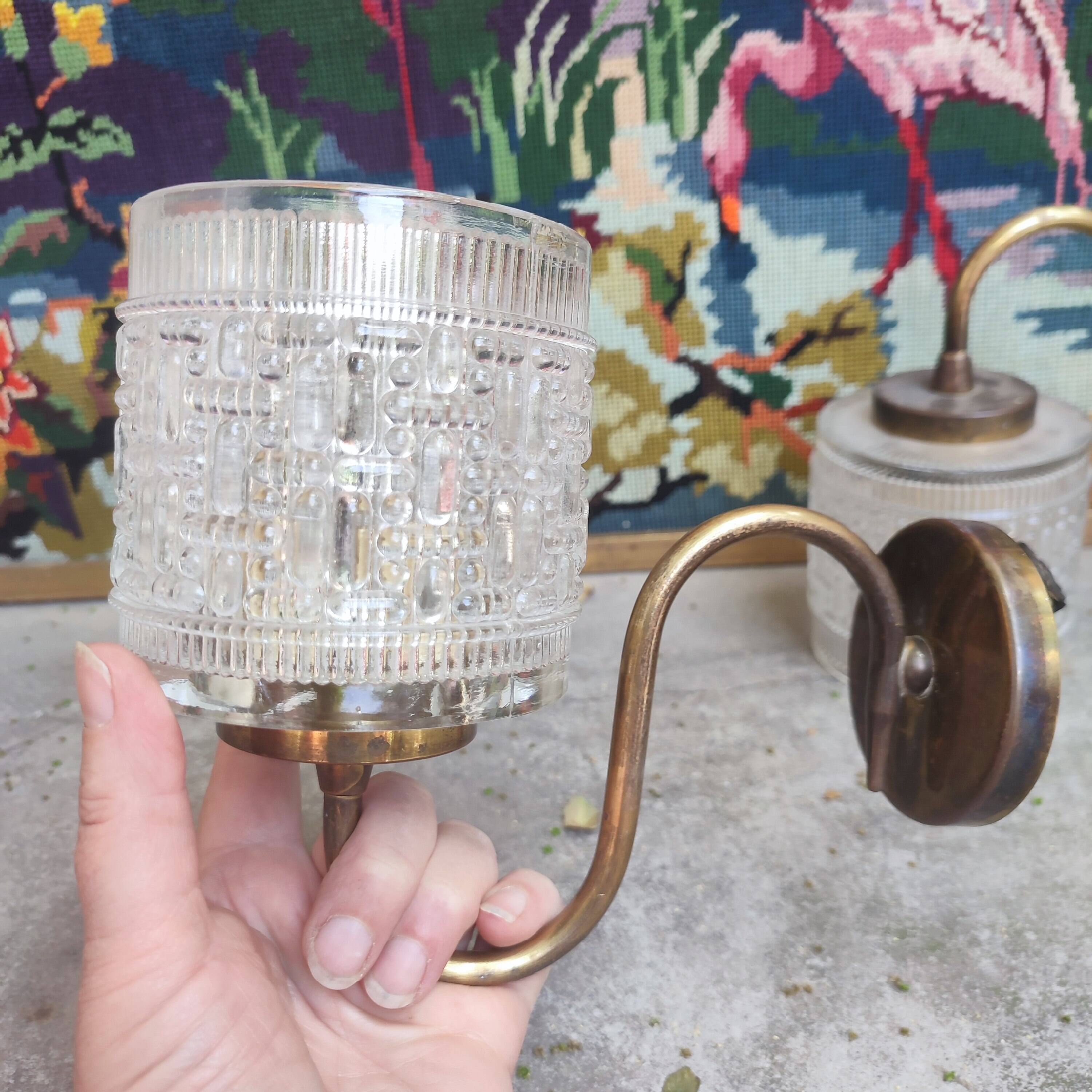 Pair of cylindrical tulip wall lights from the 1950s.
