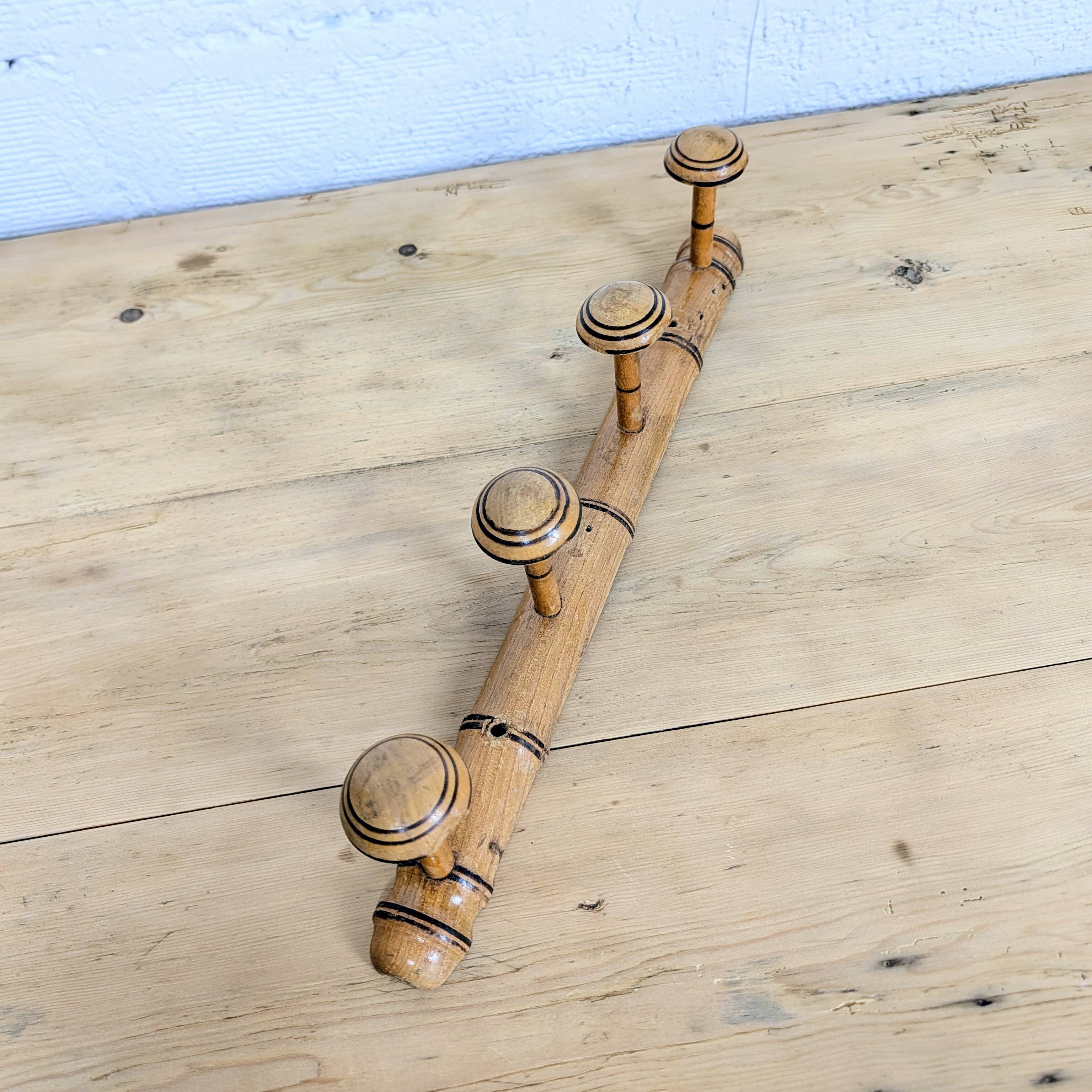 Turned wooden coat rack