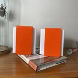 Pair of orange plexiglass wall sconces from the seventies.