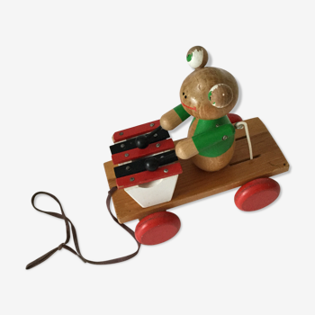 Ancient wooden toy to shoot Melle Frog plays xylophone