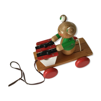 Ancient wooden toy to shoot Melle Frog plays xylophone