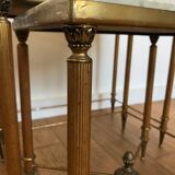 Pull-out tables in golden brass and marble