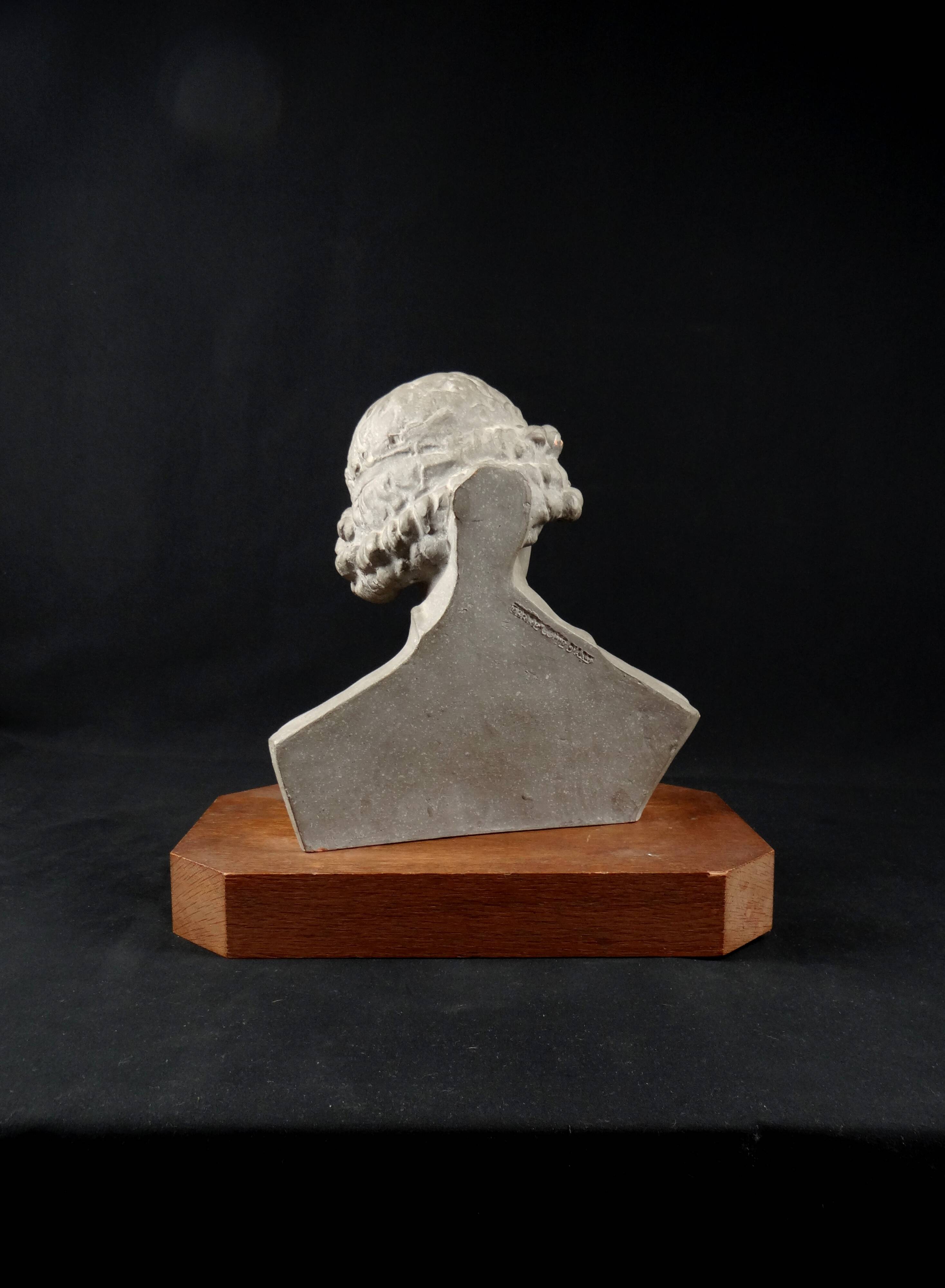 Terracotta bust of the smiling angel from Reims Cathedral with base