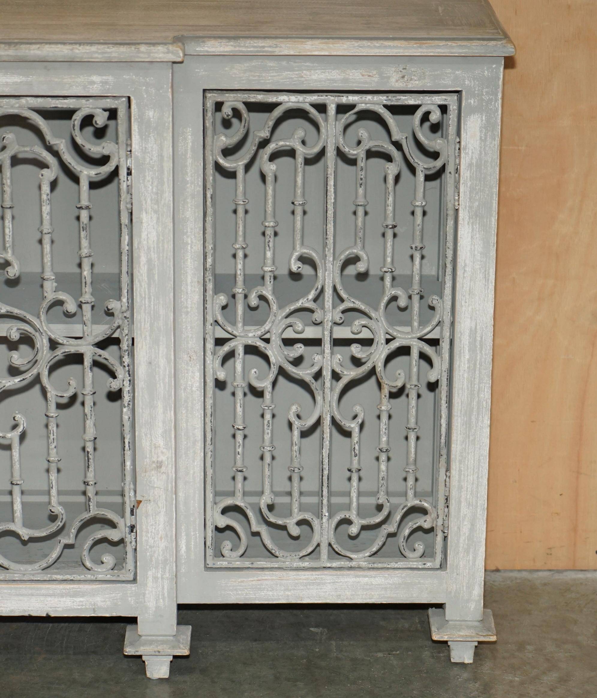 Vintage sideboard with wrought iron doors