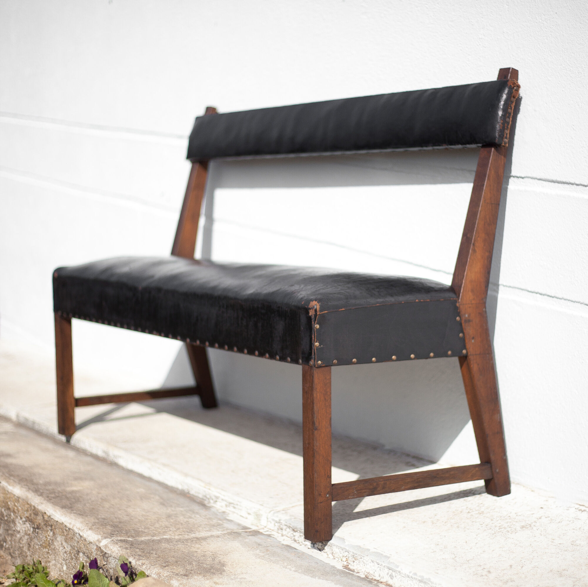 Antique wood bench and black imitation leather
