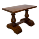 A small, rustic walnut wooden table, crafted from solid walnut wood, 1
