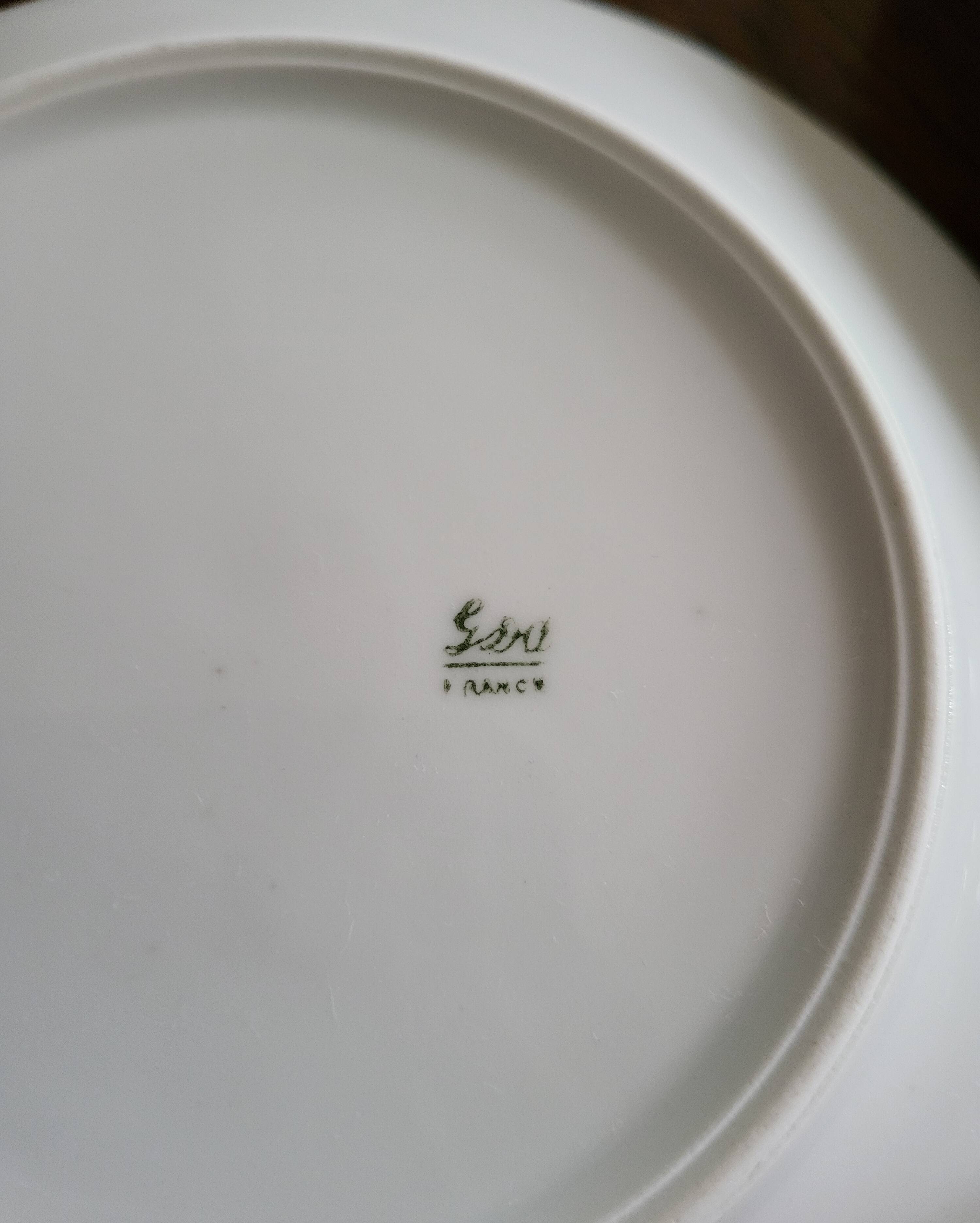 Lot of 8 small porcelain bread plates.