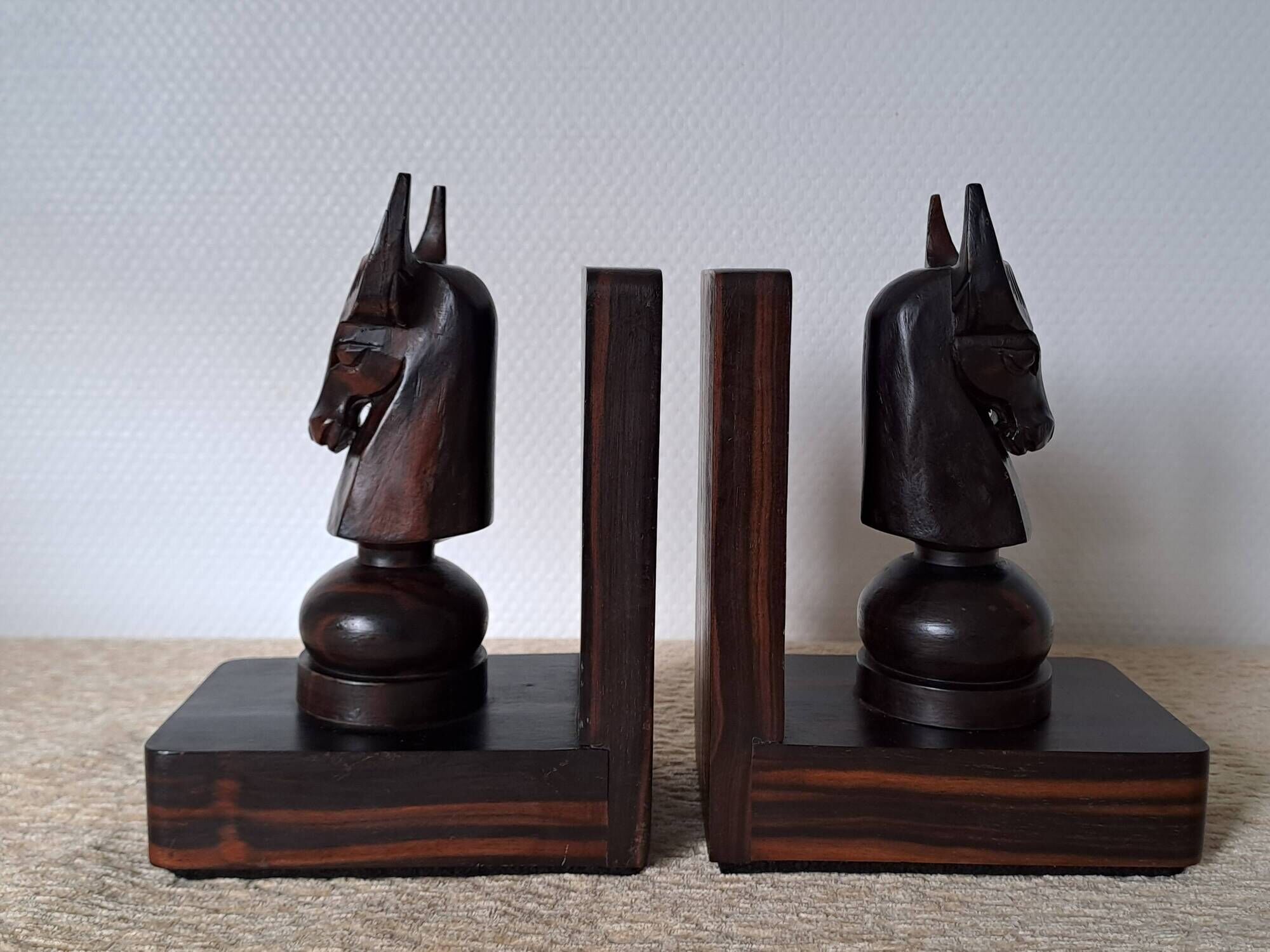 Pair of vintage wooden bookends with stylised horse heads.