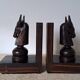 Pair of vintage wooden bookends with stylised horse heads.