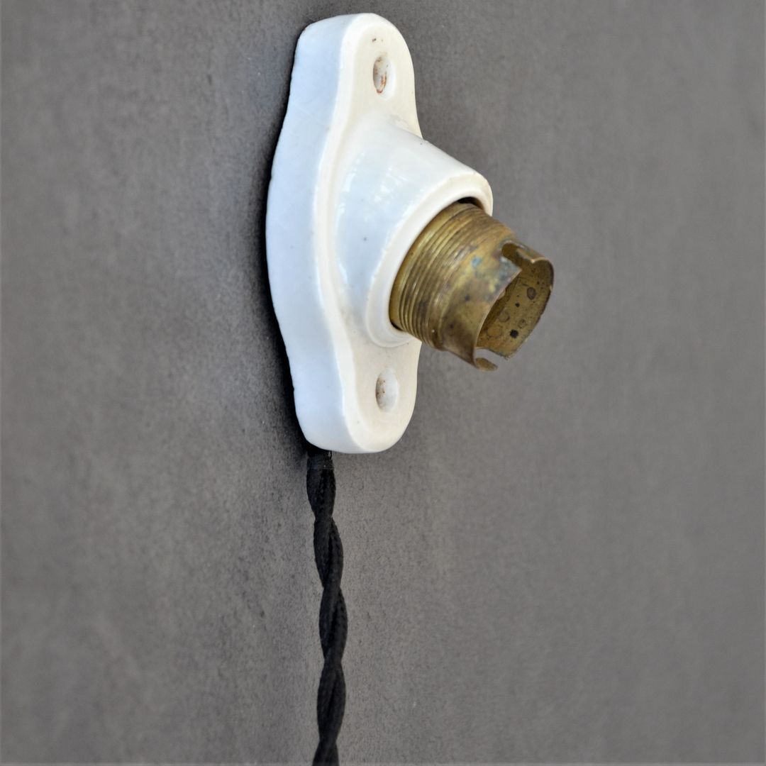 Oval porcelain hook to plug into socket