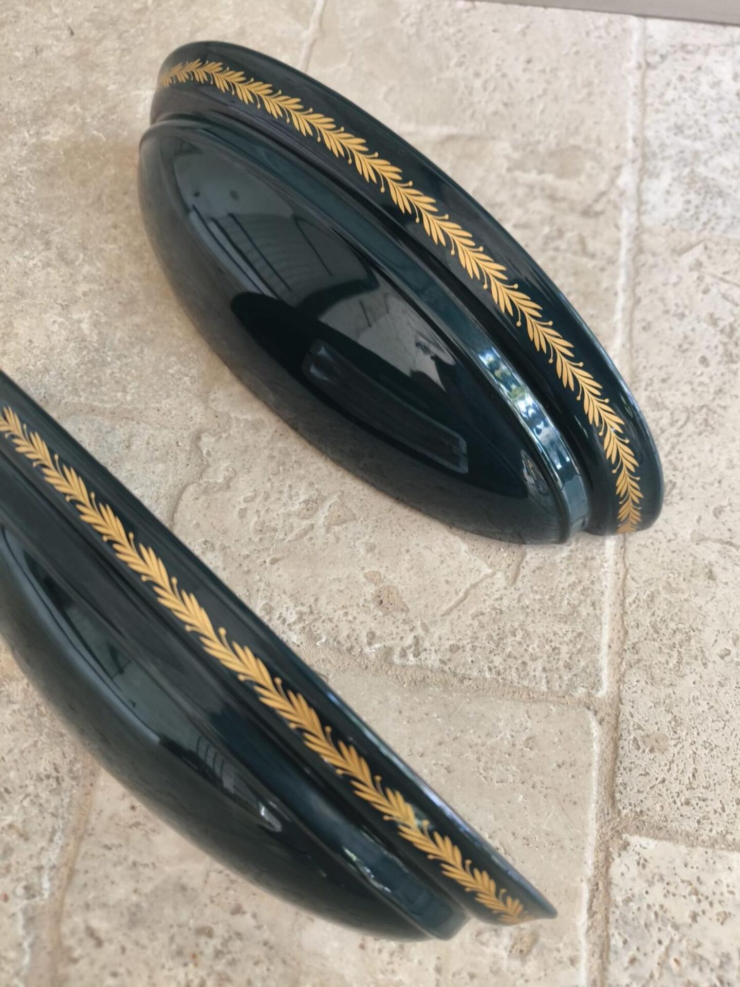 Set of two vintage wall sconces in pine green and gold.