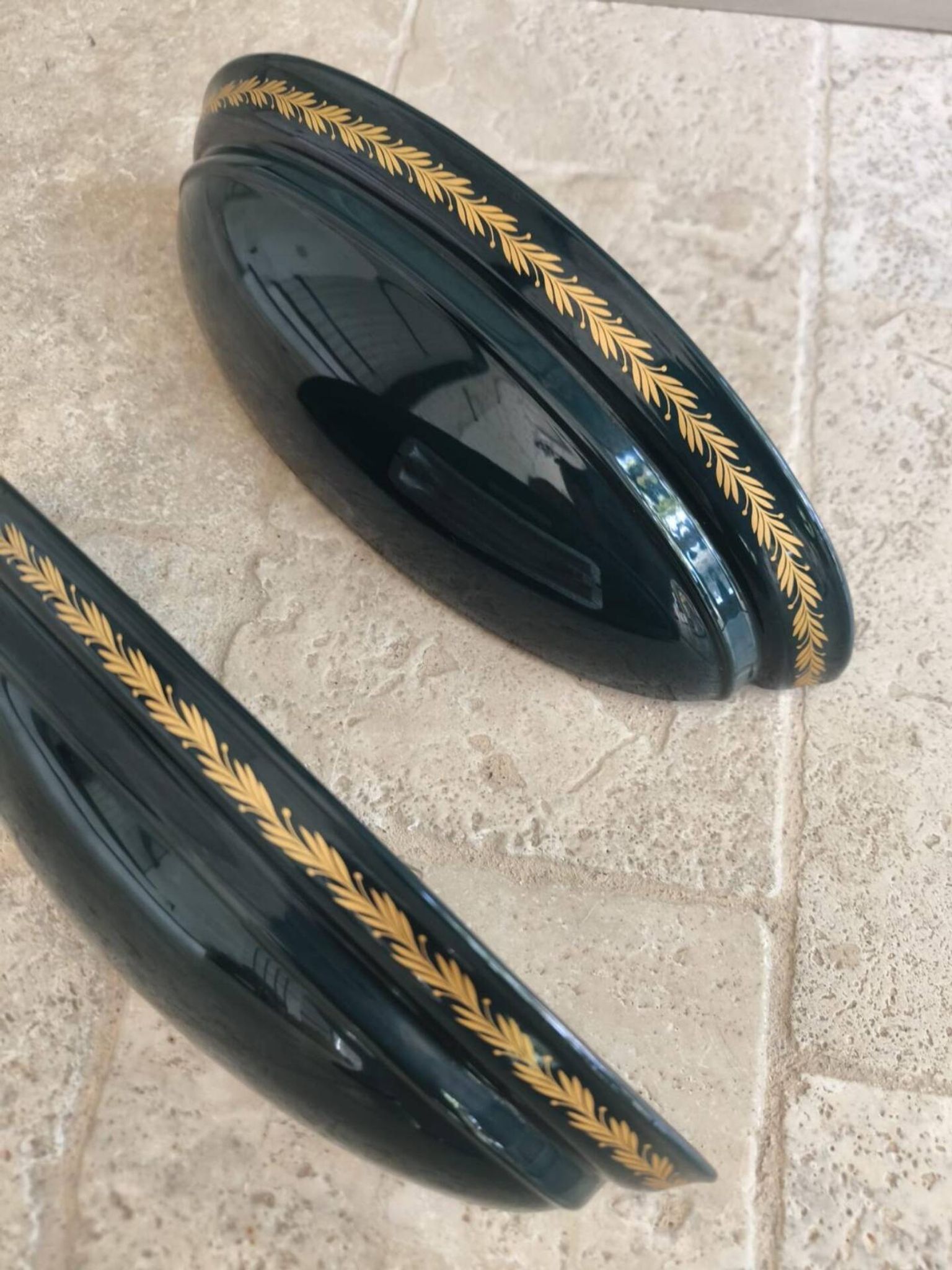 Set of two vintage wall sconces in pine green and gold.