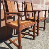 Pair of oak armchairs with straw seats and backs.