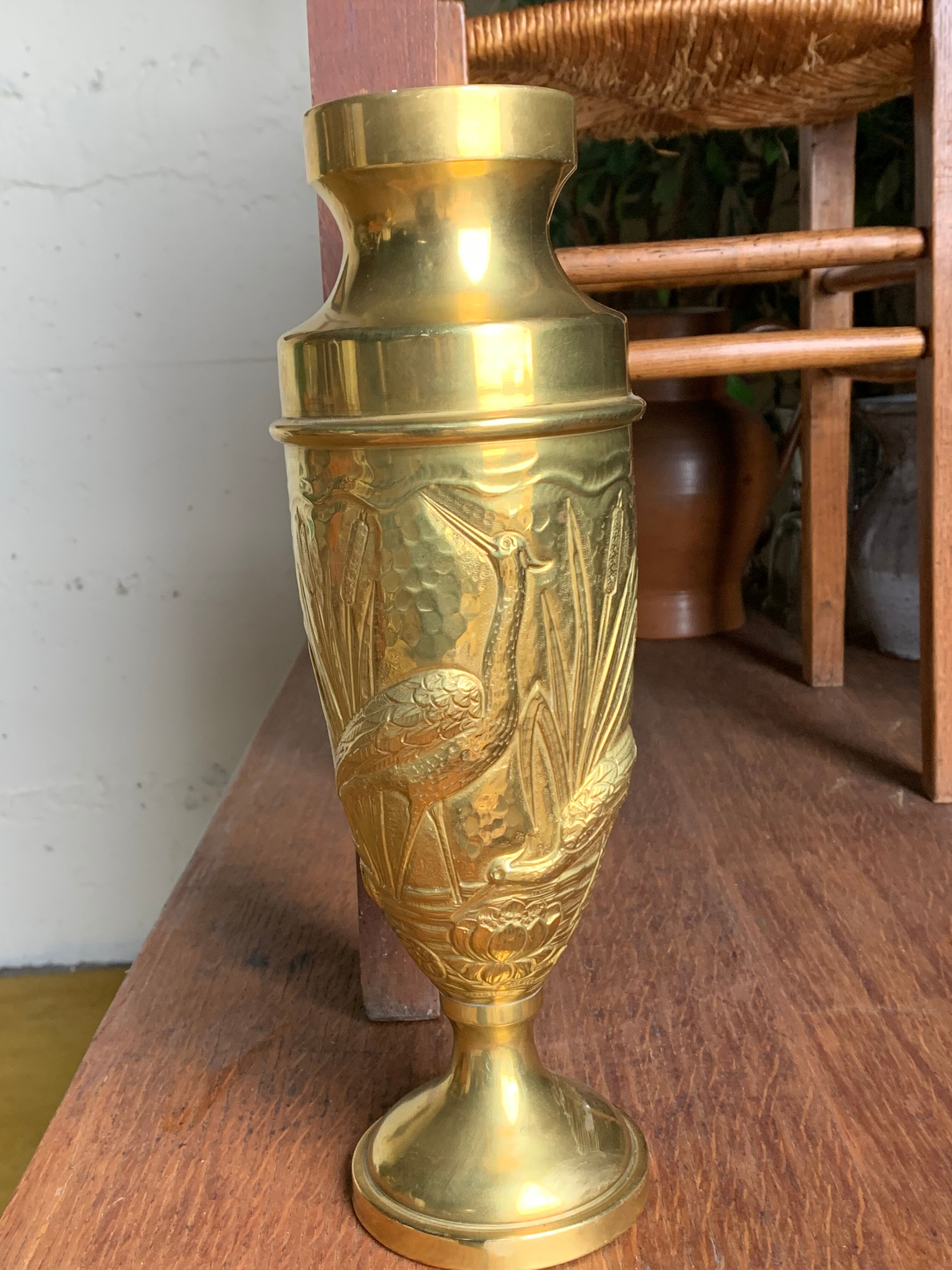 Brass vase with crane decoration