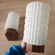 Philips wall sconces in wood and white opal.