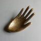 Empty-pocket brass hand